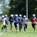  Lincoln football players run a lap around the field during practice at the school on Wednesday, August 14, 2013. Melanie Maxwell | AnnArbor.com